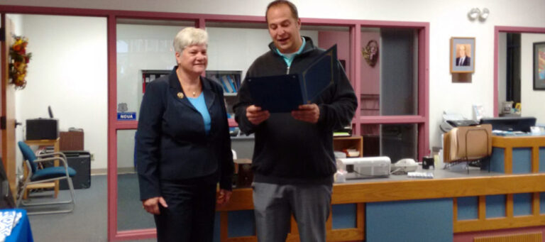 MCT CEO Patty Macek accepts a proclamation from Montgomery County Executive Matthew Ossenfort.